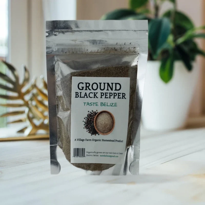 A sealed packet labeled "Import placeholder for 1133" rests on a light wooden surface with a potted plant and decorative item blurred in the background.