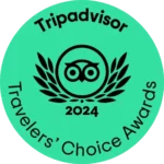 Tripadvisor Travelers' Choice Awards 2024 logo on a green circular background with an owl icon and laurel wreath.